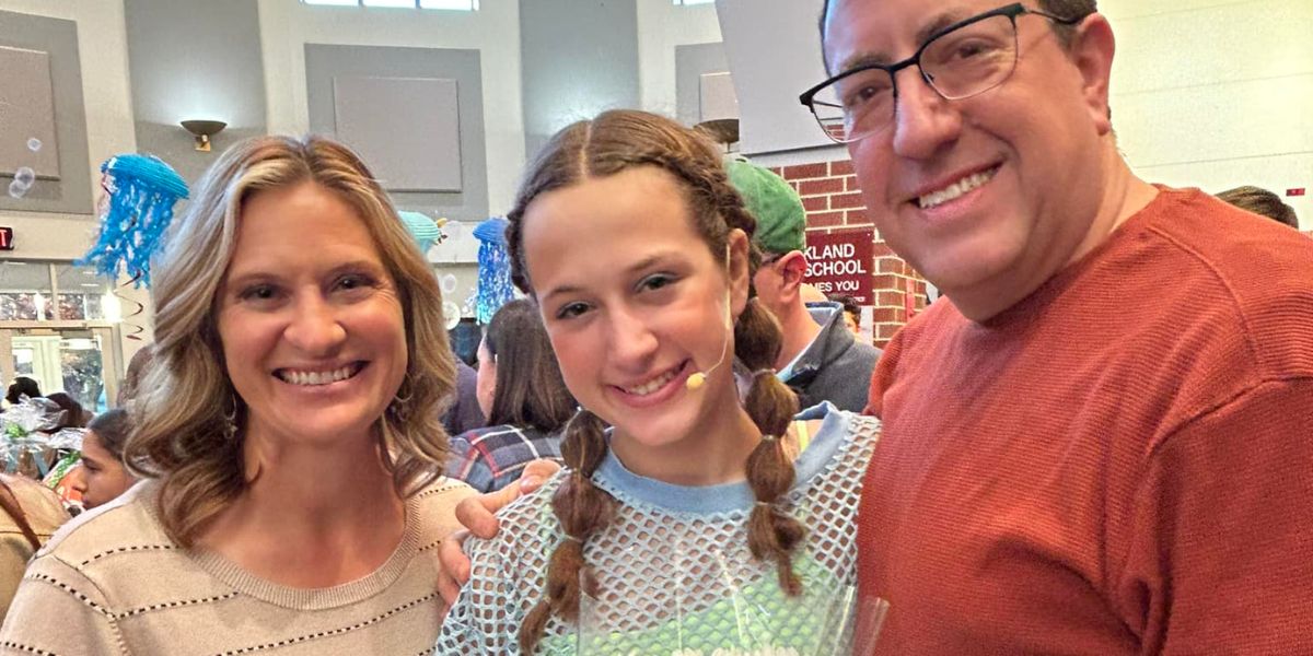 Alyssa Beckwith with her daughter celebrating a performance in Finding Nemo Jr.